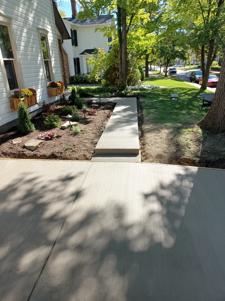 Freshly-poured concrete driveway and walkway at a residential home in the Stow, Ohio area — Mattucci Construction (real jobsite photo)