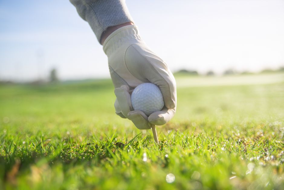 Whitemarsh Island Resort Golfer tees up golf ball
