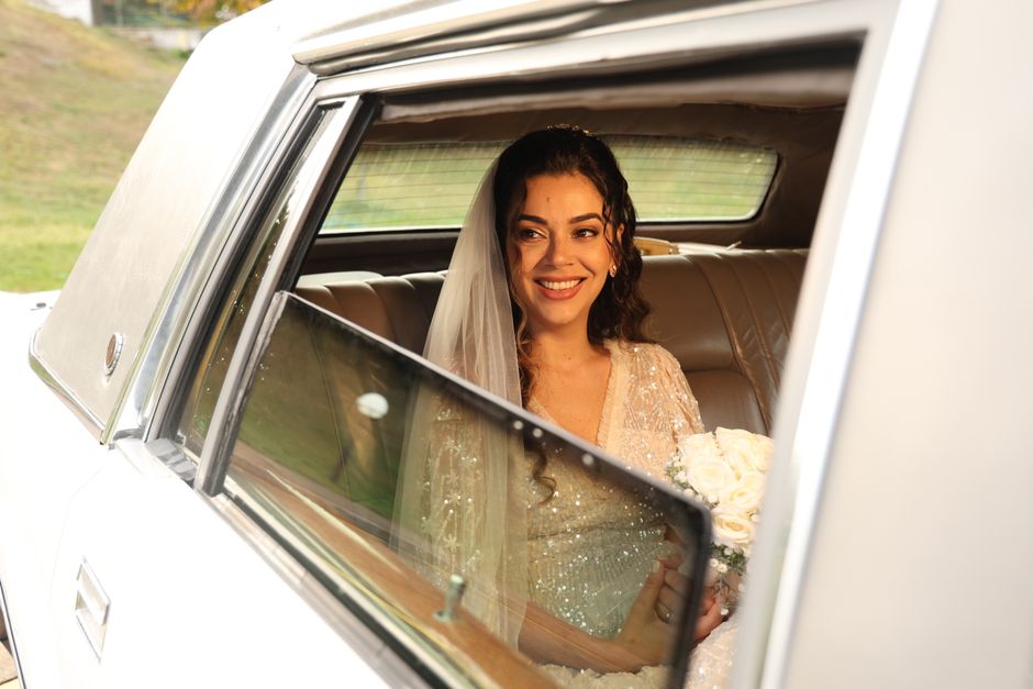 happy couple in a wedding limousine